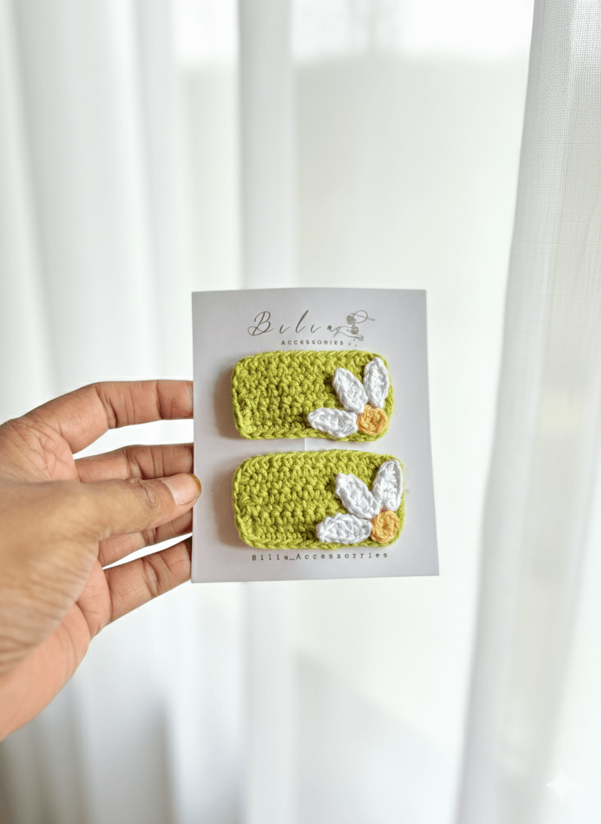 green crochet hair clips with white daisy flower design