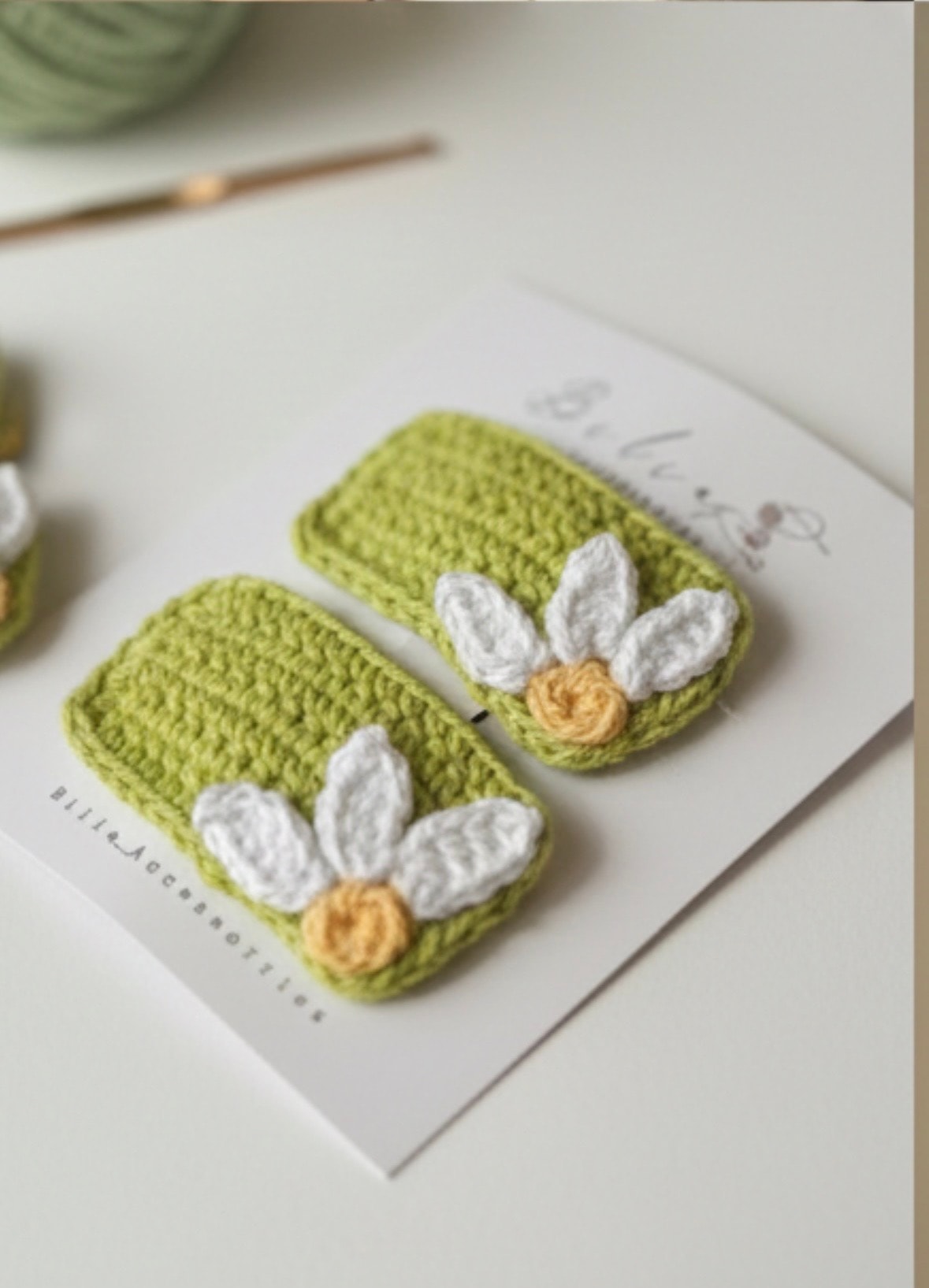 green crochet hair clips with white daisy flower design